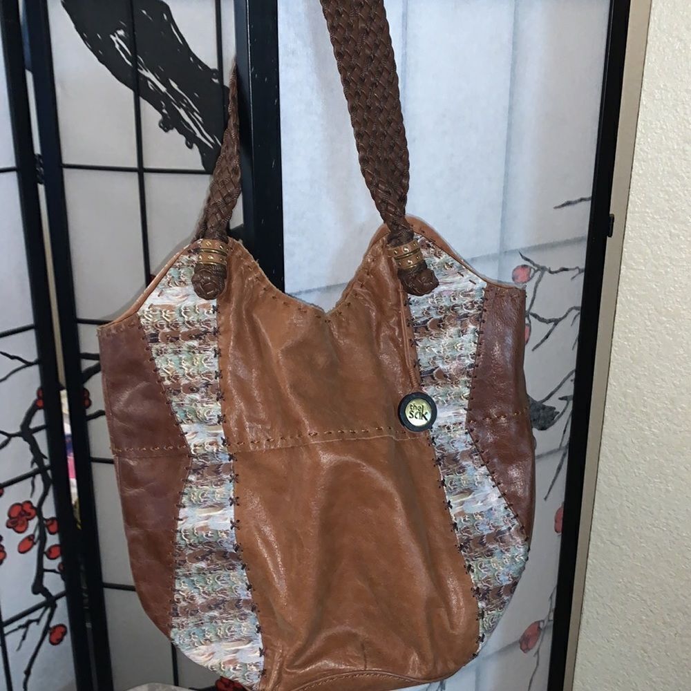 The Sak bohemian leather bag medium to large in size with braided straps.